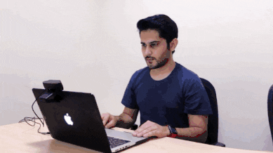 Animation showing a test-taker scanning their desk and room with an external webcam