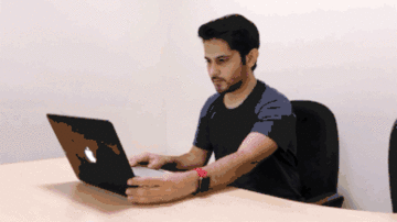 Animation showing a test-taker scanning their desk and room with an internal laptop webcam
